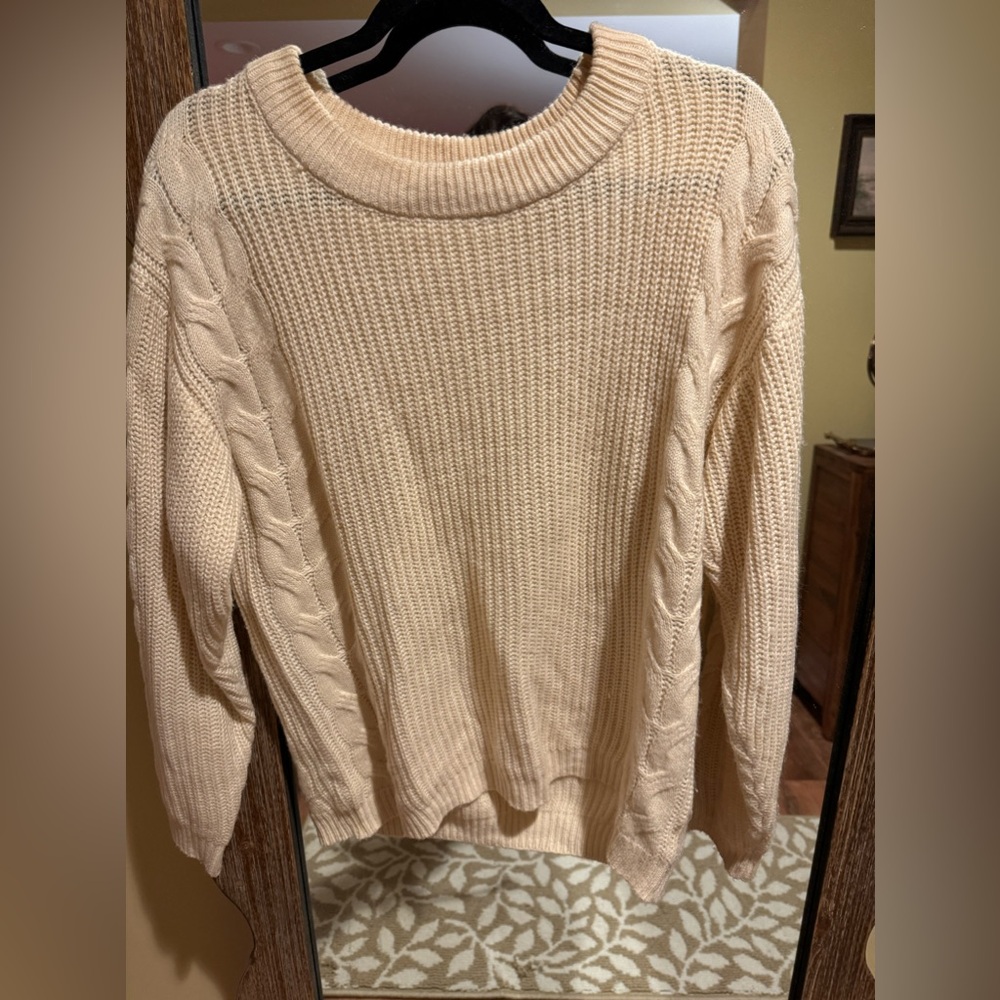 Woman's ivory cable knit sweater